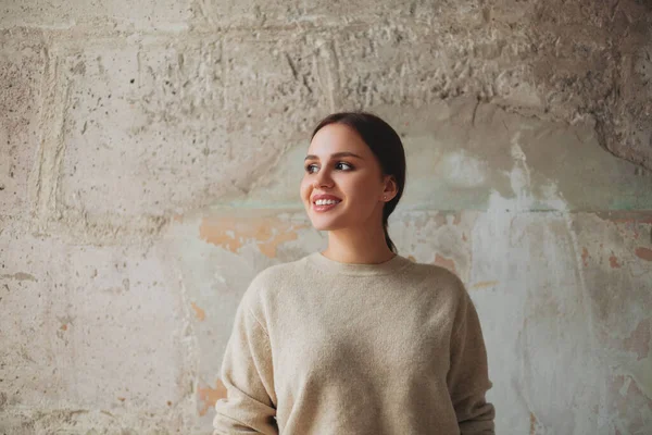 Happy Young Woman Beige Jumper Smiling Looking Away While Standing — Stok fotoğraf