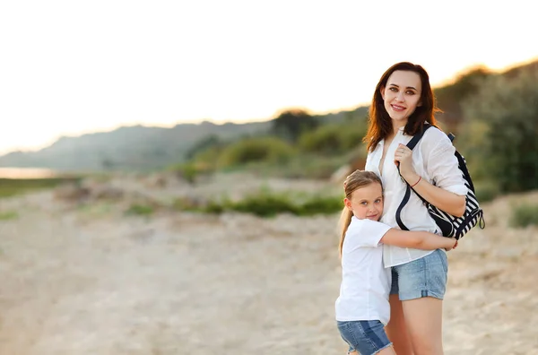 Loving Mother Hugging Adorable Girl Shore Summer Sunset — Stock Photo, Image