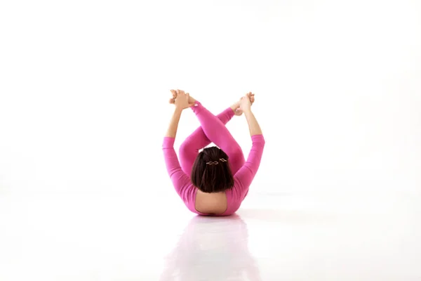 Young Slender Fit Woman Pink Long Bodysuit Performing Yoga Pose — Stock Photo, Image