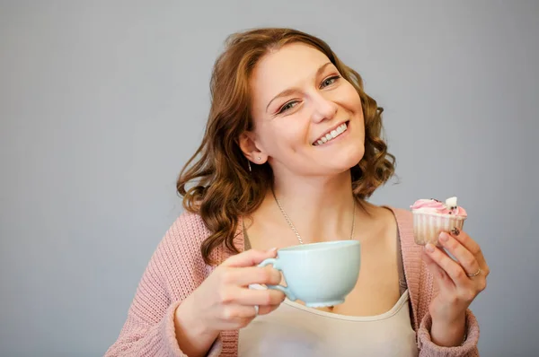 Happy Young Woman Eating Delicious Pink Cupcake Toothy Smile Closed — Stock Photo, Image