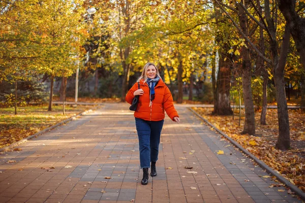 Happy Positive Middle Aged Woman Orange Jacket Smiling Camera While — Stock Photo, Image