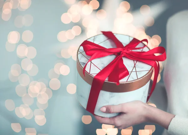 Unrecognizable Girl White Sweater Holding Present Box Tied Bright Red — Stock Photo, Image