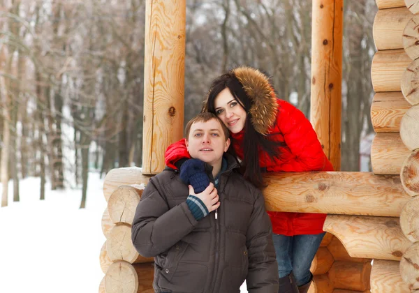 Happy couple having fun in the winter park — Stock Photo, Image