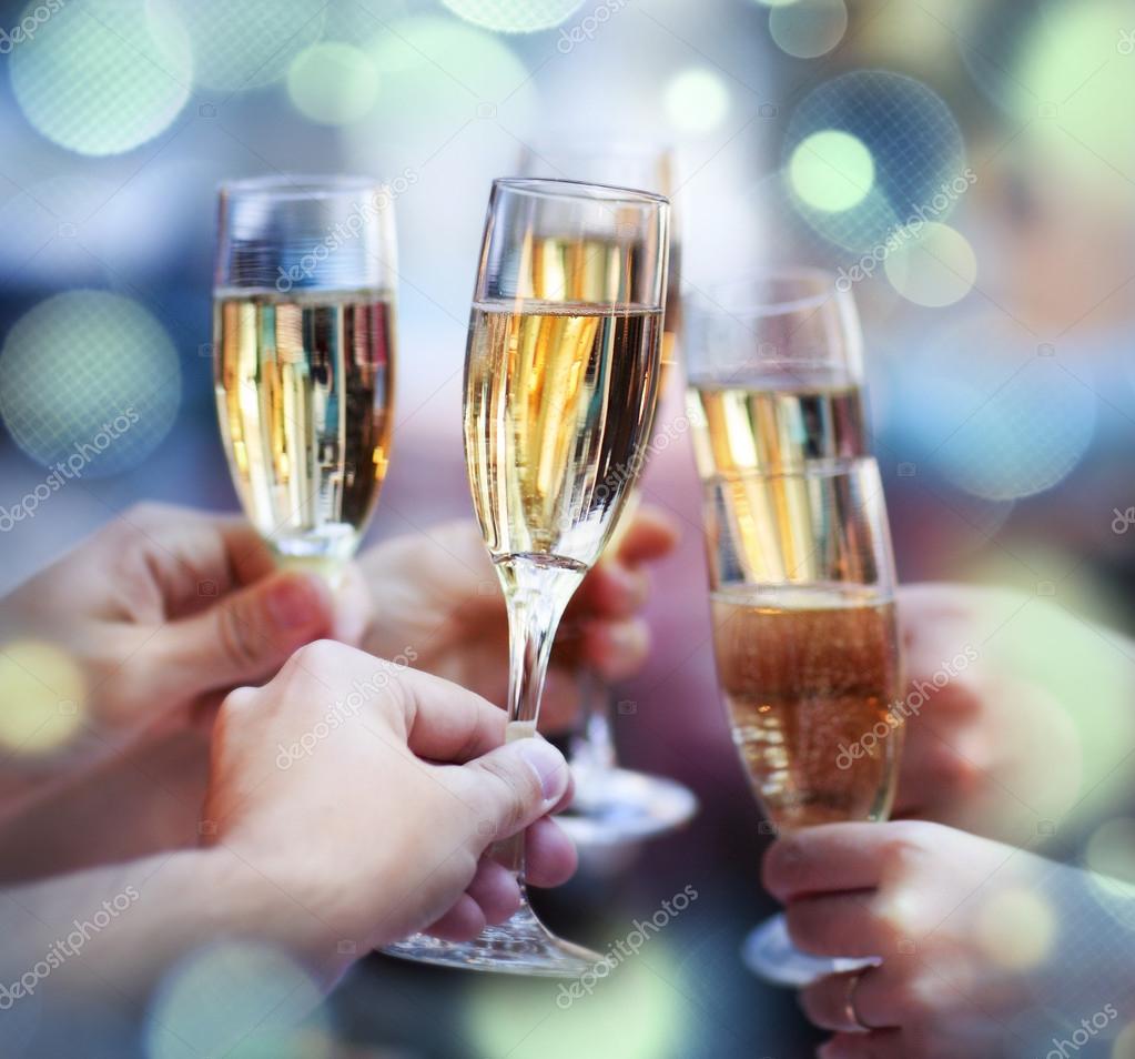 People holding glasses of champagne making a toast Stock Photo by ©dasha11  57270549