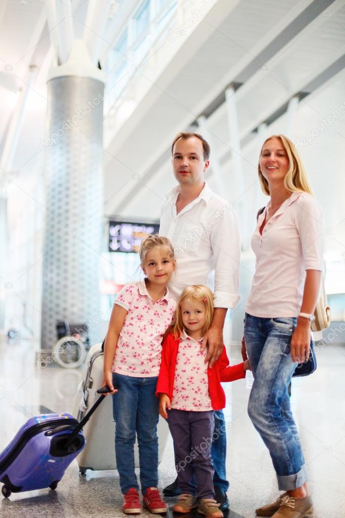 Portrait of traveling family in airport