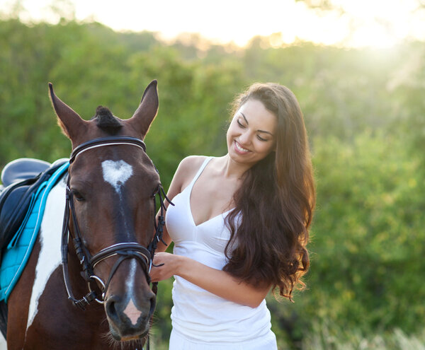 Beautiful woman and a horse