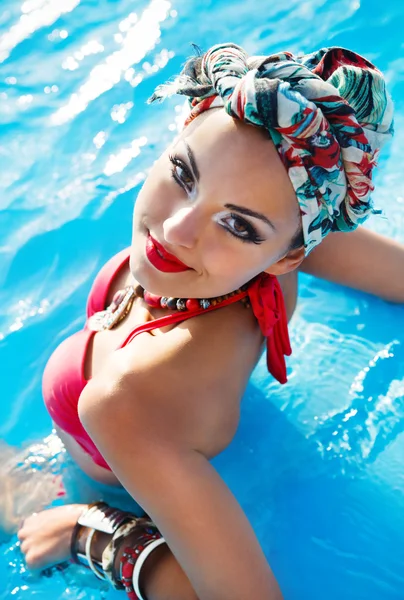 Beautiful fashionable woman wearing colored turban — Stock Photo, Image