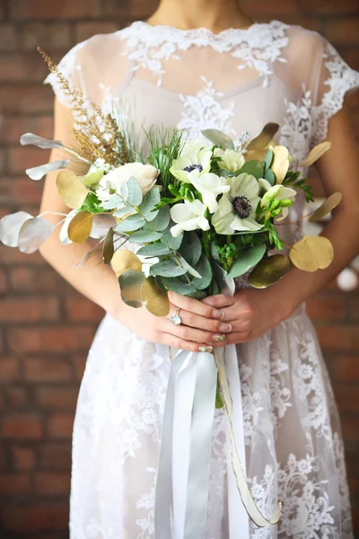 Unusual wedding bouquet in retro style at hands of a bride — Stock Photo, Image