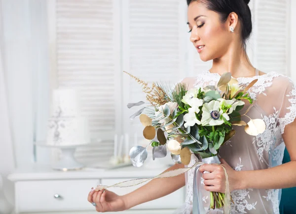 Unusual wedding bouquet at hands of a bride — Stock Photo, Image