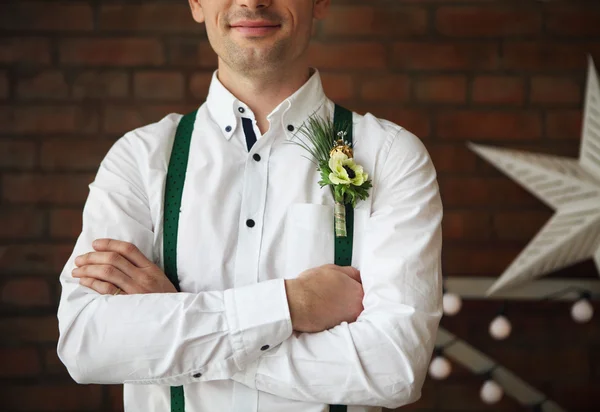 Groom wearing buttonhole with white anemone — Stock Photo, Image