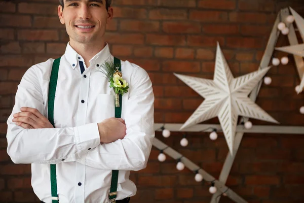 Groom wearing buttonhole with white anemone — Stock Photo, Image