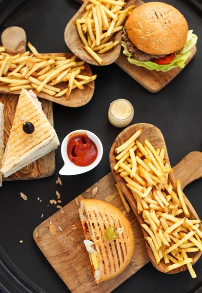 Closeup of burgers and french fries — Stock Photo, Image