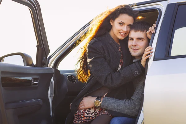 Young smile couple romantic sitting in car