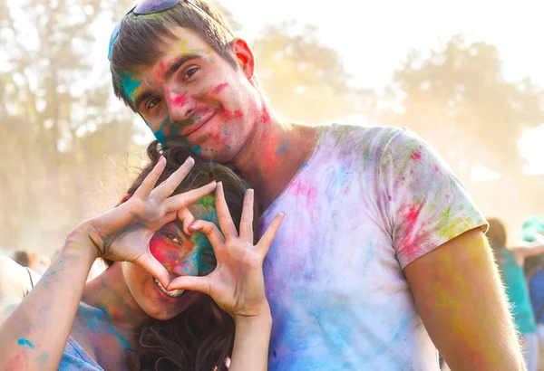 Happy couple in love on holi color festival — Stock Photo, Image