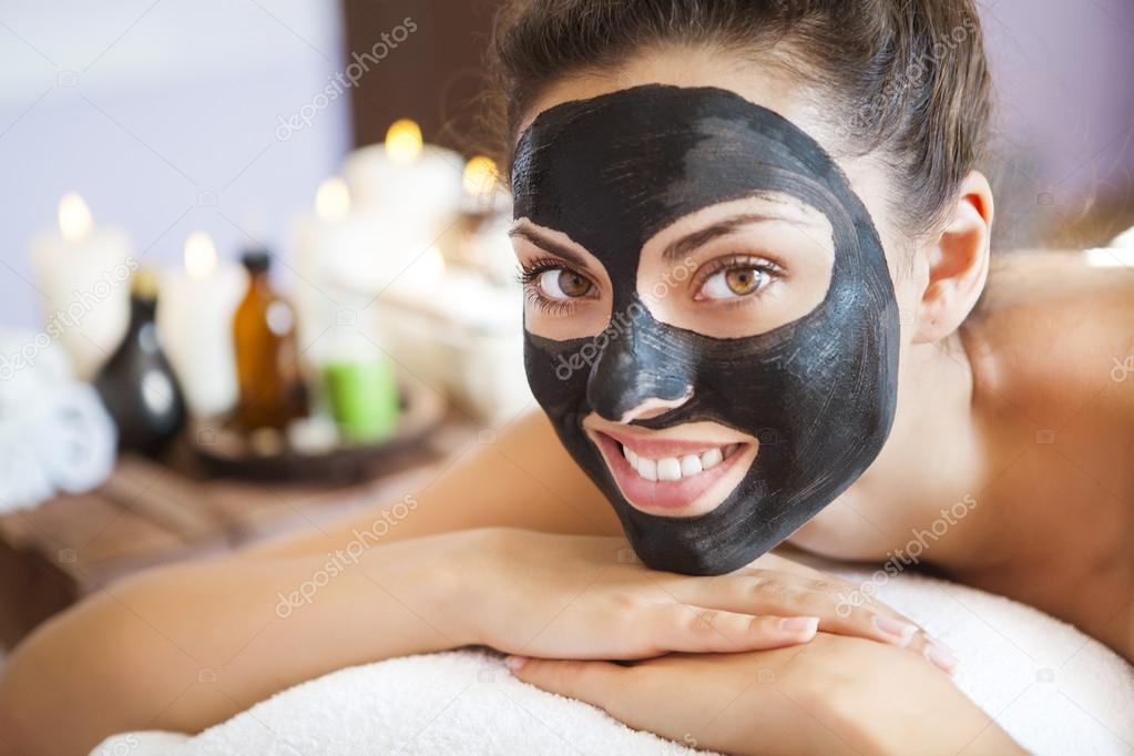 Young beautiful woman in a mask for the face of the therapeutic