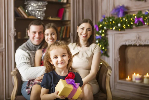 Stylish family celebrating christmas in room over christmas tree — Stock Photo, Image