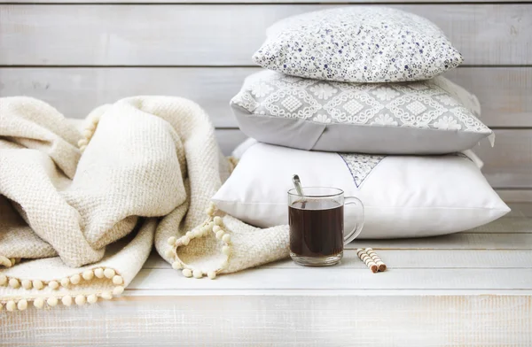 Cozy still life with coffee, pillows and plaid — Stock Photo, Image