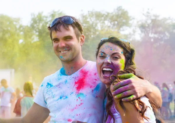 Happy couple in love on holi color festival — Stock Photo, Image