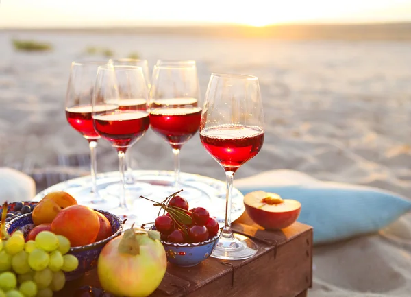 Glasses of the red wine on the sunset — Stock Photo, Image