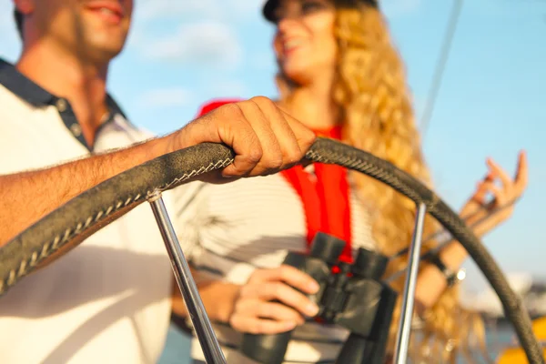 Couple on a yacht enjoy bright sunny day on vacation — Stock Photo, Image