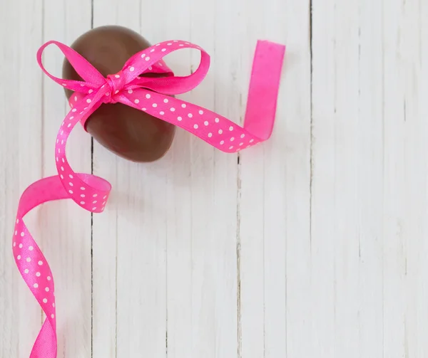 Chocolate Easter egg on wooden background — Stock Photo, Image