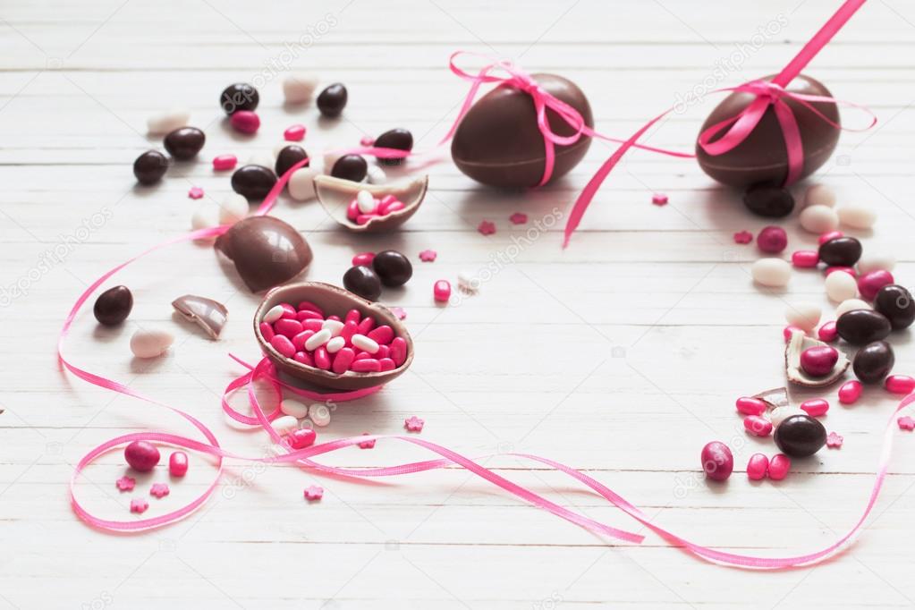 Chocolate eggs on wooden background