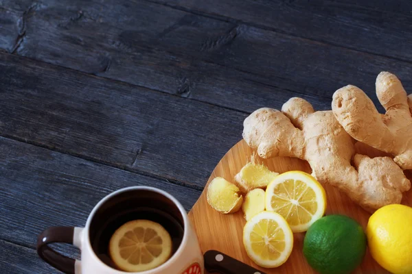 Cup of Ginger tea with lemon and honey on dark blue background — Stock Photo, Image