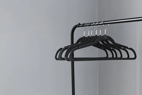 Empty Black Clothes Hanger Gray Wall Background — Stock Photo, Image