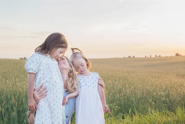 Mother Two Little Daughters Walk Field Sunset — Stock Photo, Image