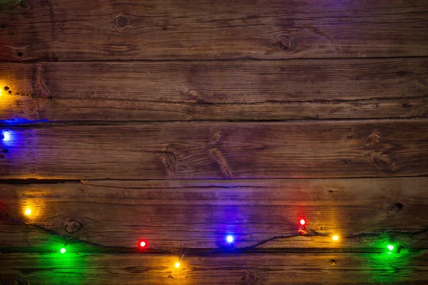 Ghirlanda Elettrica Con Lampadine Multicolori Una Superficie Legno Natale Capodanno — Foto Stock