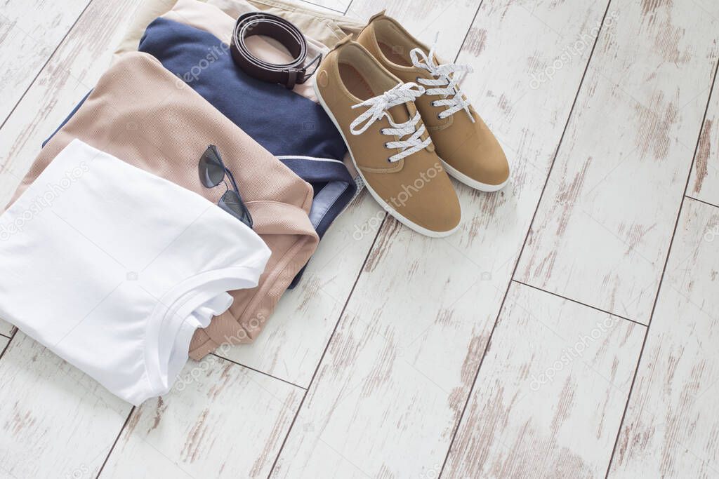 mens summer basic clothes and shoes on old wooden floor