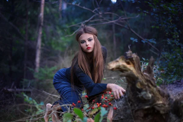 Beautiful witch in forest — Stock Photo, Image