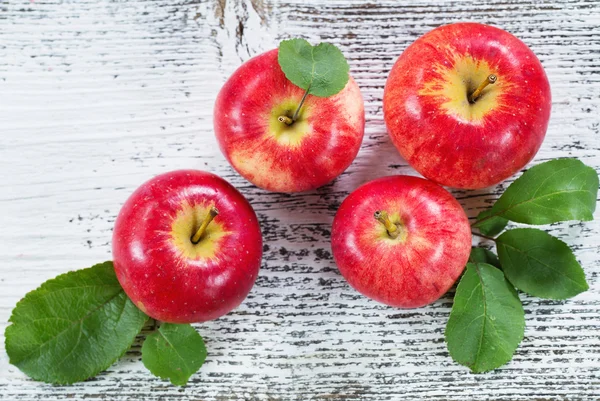 Apples on wooden background — Stock Photo, Image