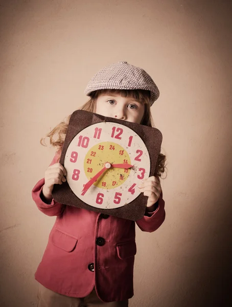 Little child holding old clock — Stock Photo, Image