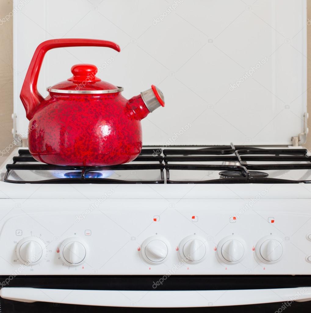 Tea kettle with boiling water on gas stove Stock Photo by ©Kruchenkova  58951339