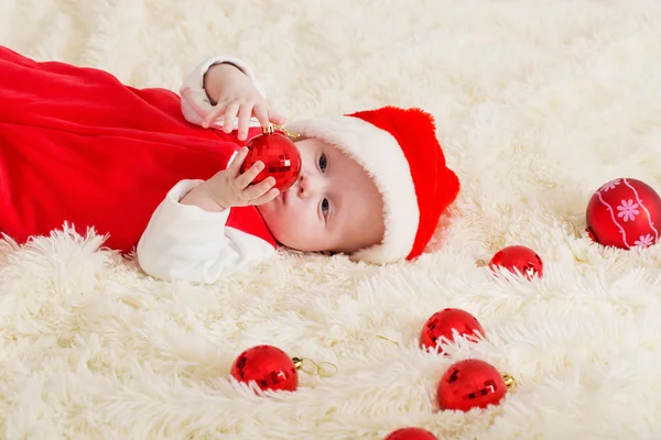 Baby in rode kerstmuts — Stockfoto