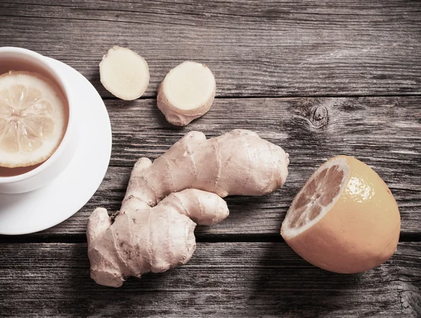 Ginger tea with lemon in a white cup — Stock Photo, Image