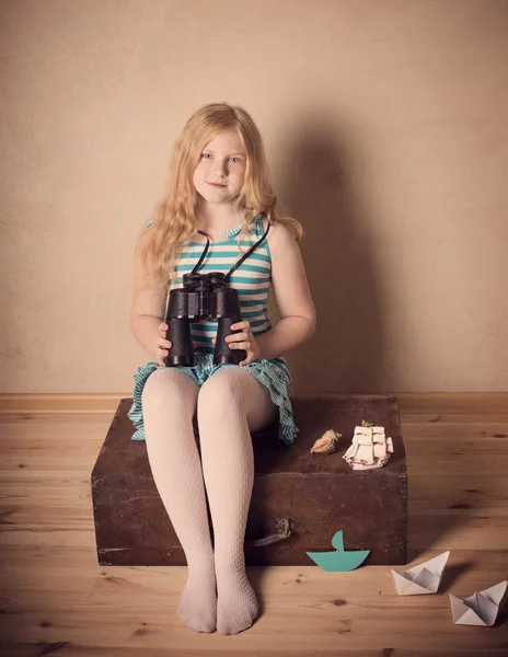 Happy girl playing with toy sailing boat indoors — Stock Photo, Image