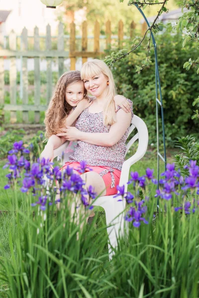 Daughter with her mother in the garden — Stock Photo, Image