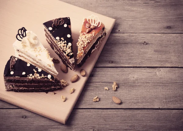 Cake on old wooden table — Stock Photo, Image