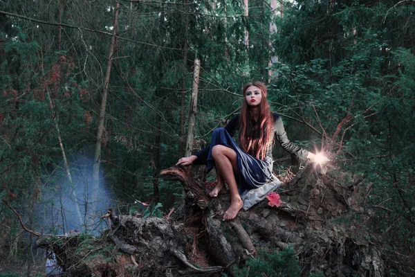 Beautiful witch in forest — Stock Photo, Image