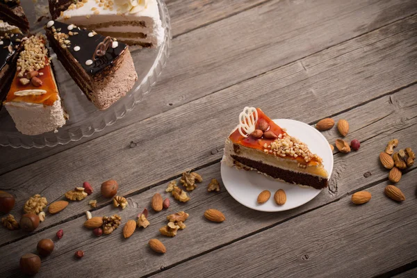 Cake on old wooden background — Stock Photo, Image