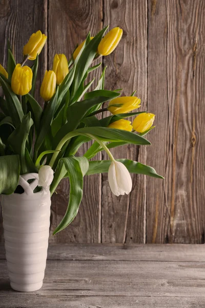 Tulips over wooden background — Stock Photo, Image