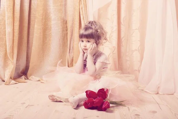 Adorable little girl dressed as a ballerina in a tutu indoor — Stock Photo, Image