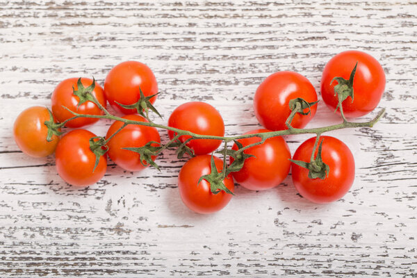 cherry tomatoes on rustic wooden background