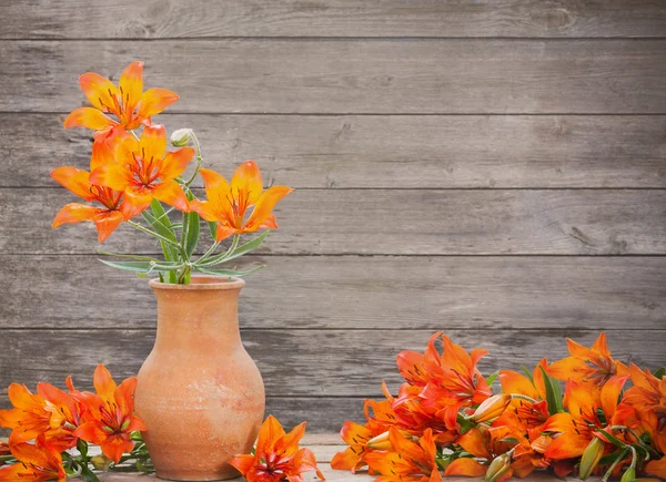 Orange lily on wooden background — Stock Photo, Image