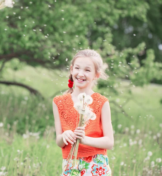 Beautiful girl with dandelions — Stock Photo, Image
