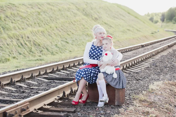 Mother with the daughter go on rails — Stock Photo, Image