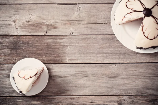Cake on wooden table background — Stock Photo, Image