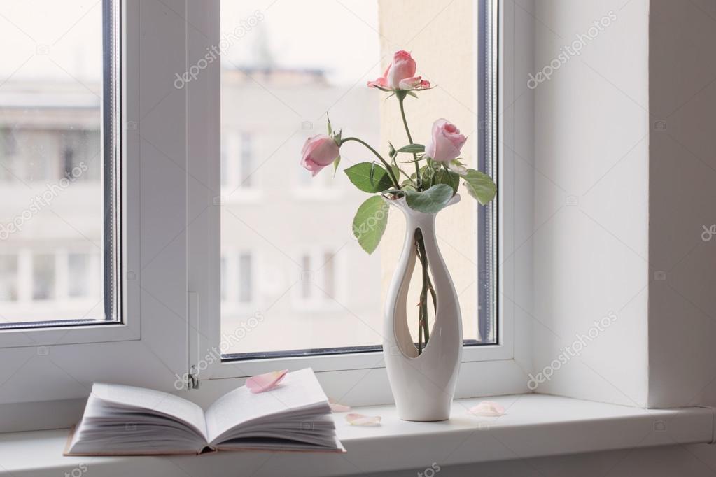 still life of pink rose in ceramic vase